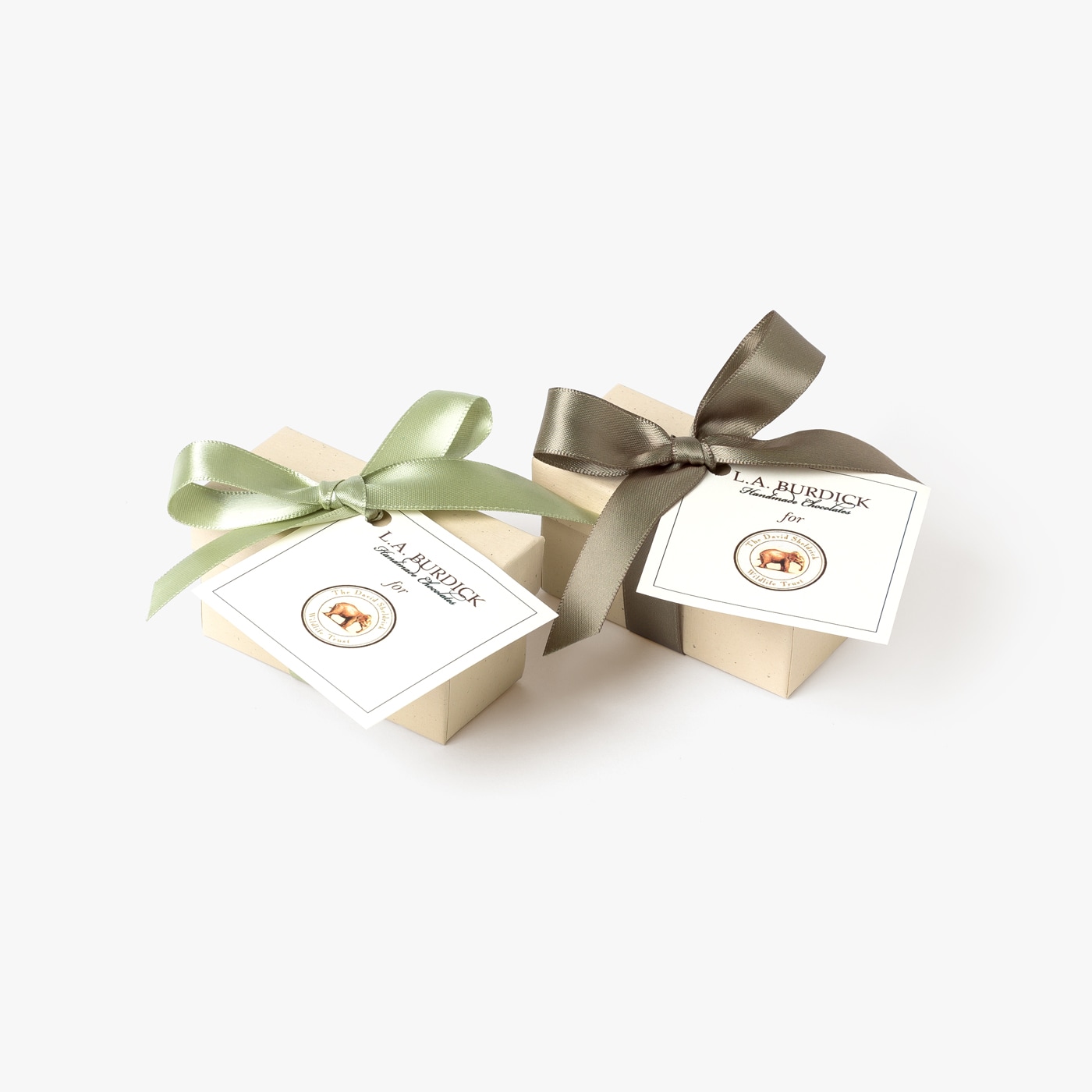 Two gift boxes showing beautiful packaging and satin bows.